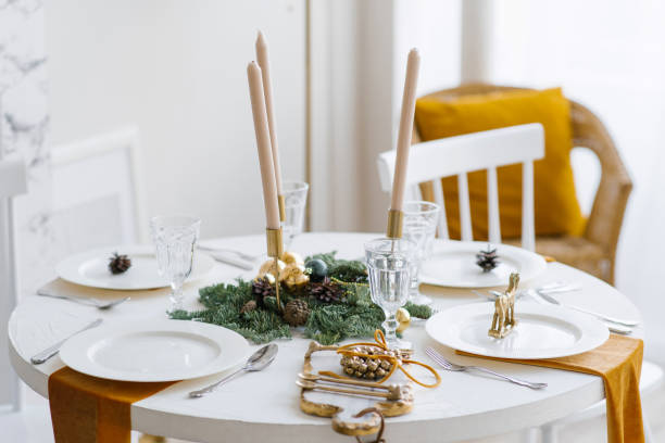 istock Beautiful table setting with Christmas decorations in living room 2186462622