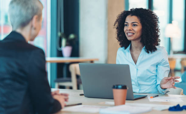 istock Businesswomen having a conversation in the office 2186472317