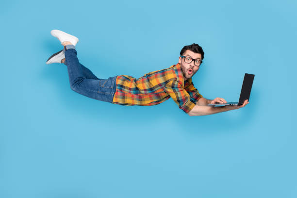 istock Full size profile portrait of impressed confused man pouted lips fly use wireless netbook isolated on blue color background 2186473655