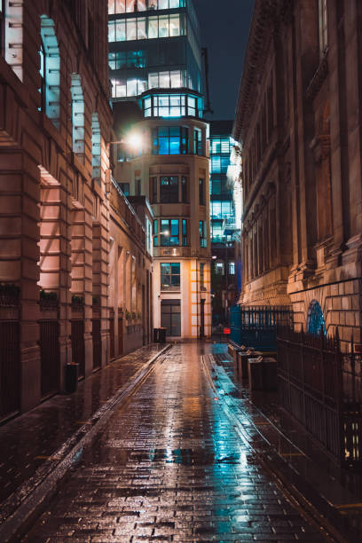 istock Narrow lane in London at night 2186474230