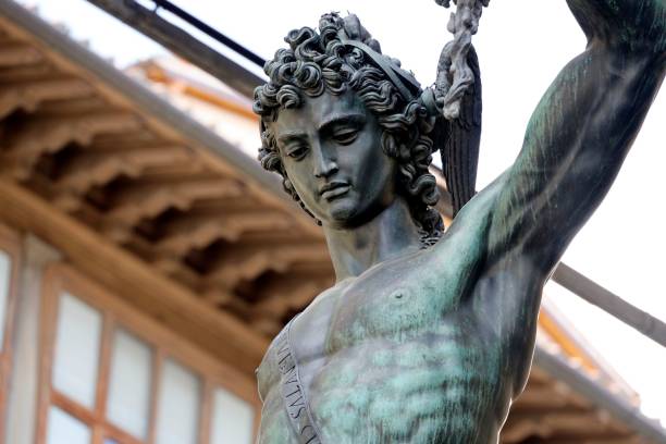 Close-up of bronze Perseus statue holding Medusa's head, showcasing intricate details