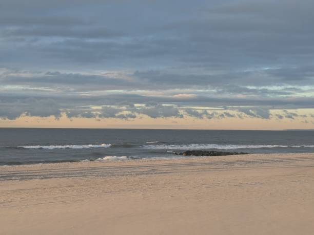 The winter morning sunrise over the ocean in Long Beach New York