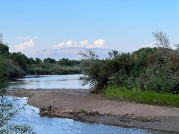 istock tranquil river with mountains in the distance 2186483164