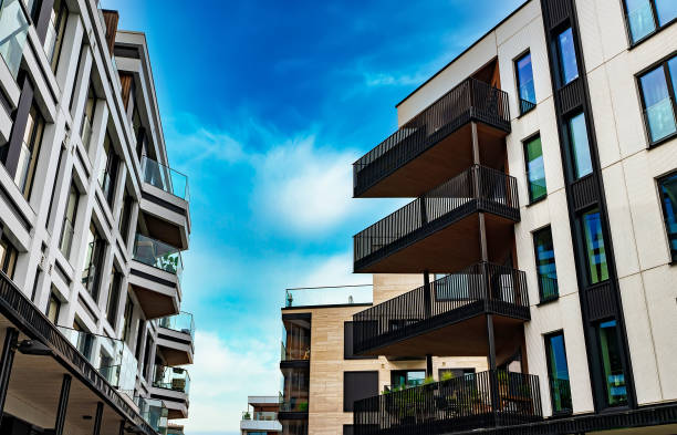 istock Modern Apartment Building with Glass Balconies and Industrial Elements. 2186483740