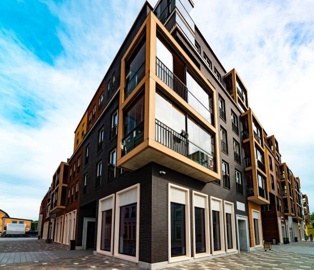 istock Modern Apartment Building with Glass Balconies and Industrial Elements. 2186483770