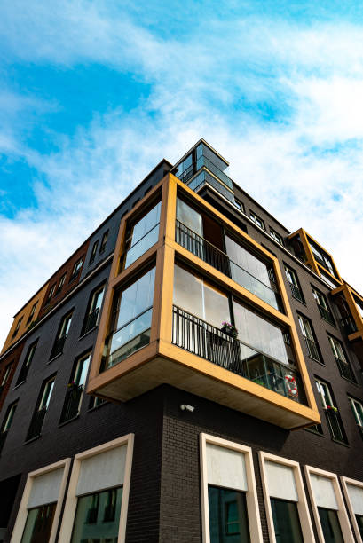 istock Modern Apartment Building with Glass Balconies and Industrial Elements. 2186483772