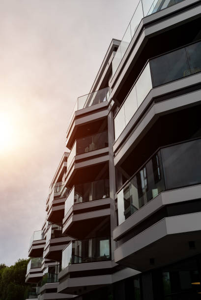 istock Modern Apartment Building with Glass Balconies and Industrial Elements. 2186483774