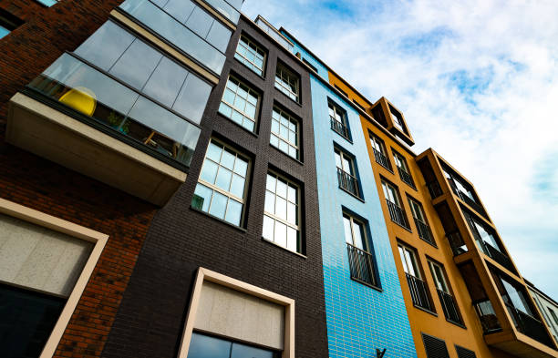 istock Modern Apartment Building with Glass Balconies and Industrial Elements. 2186483781