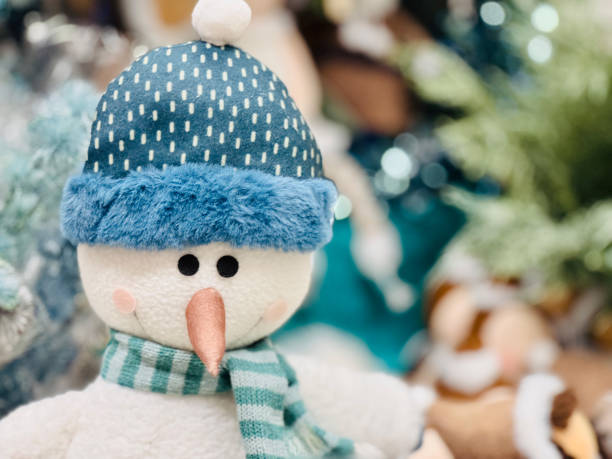 Happy snowman cheering for the falling snow. Majestic conceptual image for winter holidays. Image contains copy space. Can be used as Christmas greeting card or New Year greeting card. Can be used for winter holidays storytelling, holiday invitations etc. Not AI