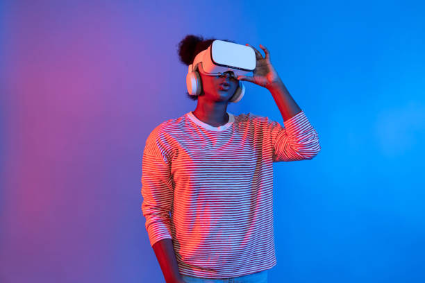 istock Young African woman with VR presentation through meta study online. Contrivance. 2186484930
