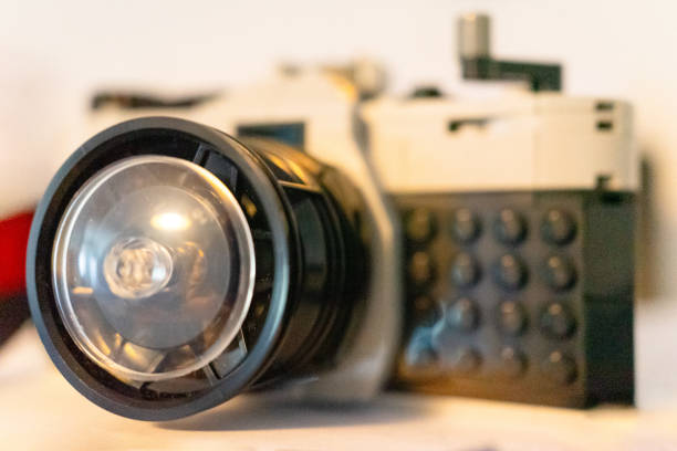A creative tou build resembling a vintage camera, complete with a detailed lens and textured body design.