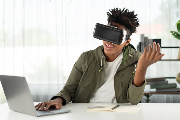 istock Young African American studying through VR glasses online course. Contrivance. 2186487840