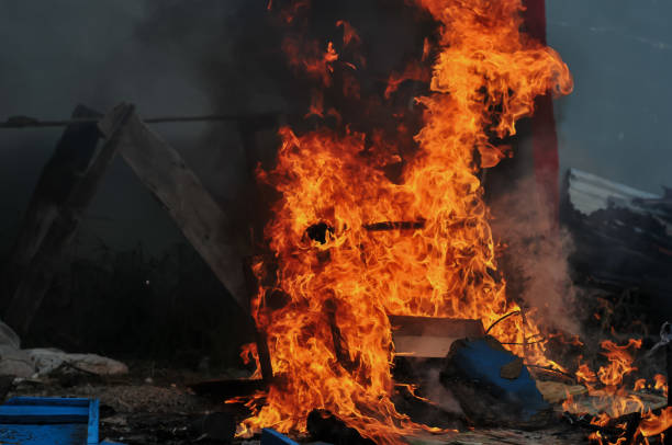 istock flames in the woodpile and rubbish 2186489112
