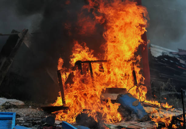 flames in the woodpile and rubbish