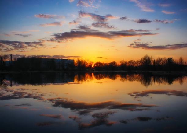 sunset over a small calm lake