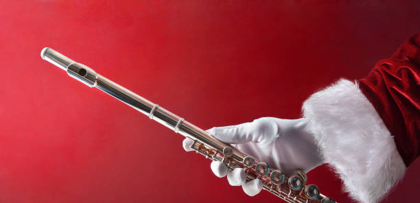istock Santa Claus showing a transverse flute on red isolated background 2186493641