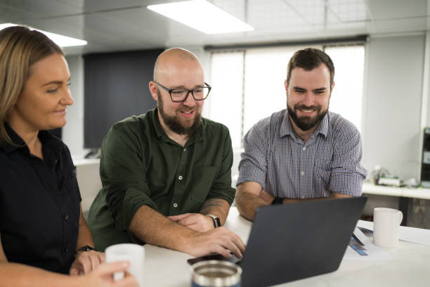 istock Business people working on laptop computer in modern office and analysing documents 2186495156