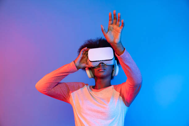 istock Young African wearing VR through meta select 3D hologram data app. Contrivance. 2186495288