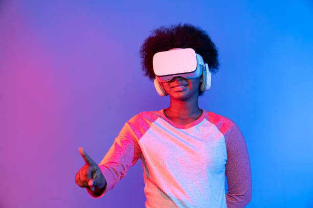 istock Young African wearing VR through meta select 3D hologram data app. Contrivance. 2186495594