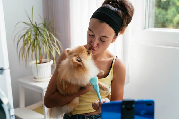 istock Affectionate moment between woman and her furry dog 2186498474