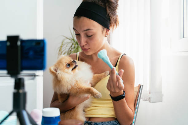 istock Young woman cuddles dog with playful interaction 2186498475