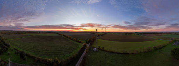 istock Aerial Panoramic Landscape at Sunset with Wind Turbines 2186498560