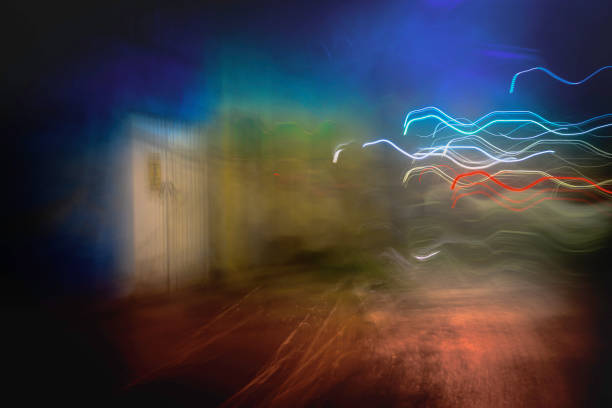 Abstract motion blur light trail action background with fluctuating light beans entering the closed door: A mystery concept of impossibility, breakthrough, innovation, and quantum ideas