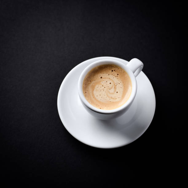 istock Cup of coffee on dark paper background. Close up. Copy space. 2186501064