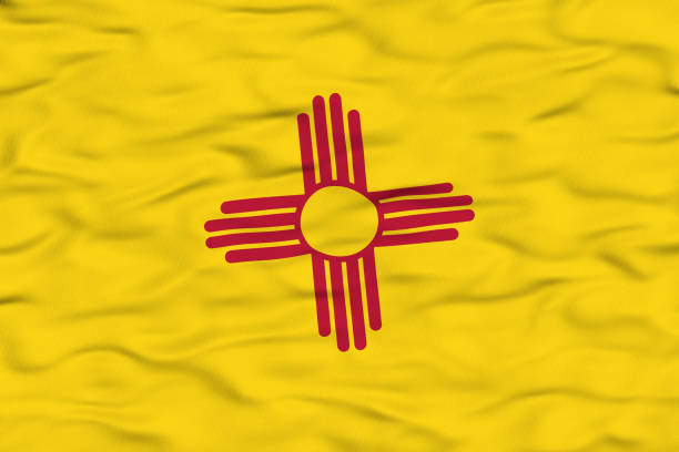 The New Mexico state flag features a bright yellow field with the red Zia sun symbol in the center. The design represents the state’s Native American heritage and its connection to the four directions, seasons, times of day, and stages of life.