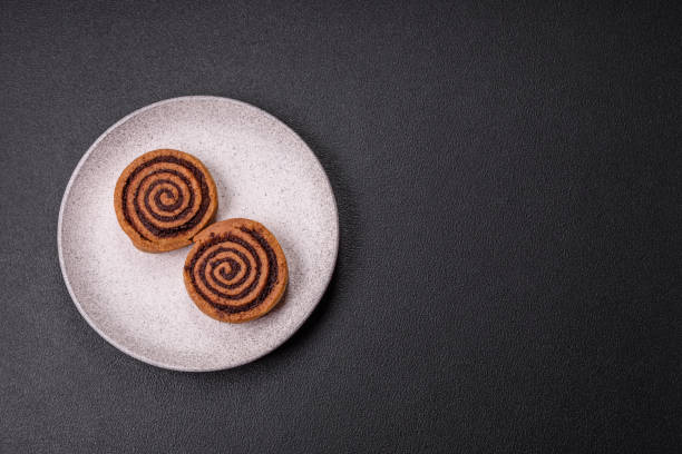 istock Freshly baked cinnamon roll with spices and cocoa filling 2186507880