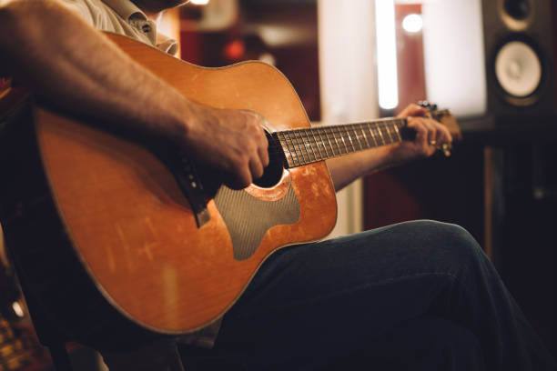 istock Acoustic guitar recording session in a studio atmosphere. Close-up. 2186509330