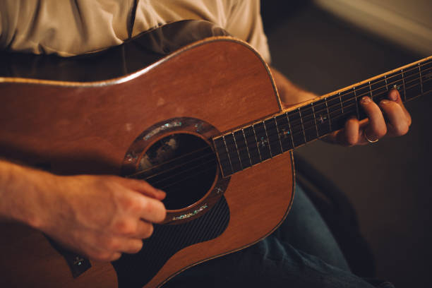 istock Acoustic guitar recording session in a studio atmosphere. Close-up. 2186509333