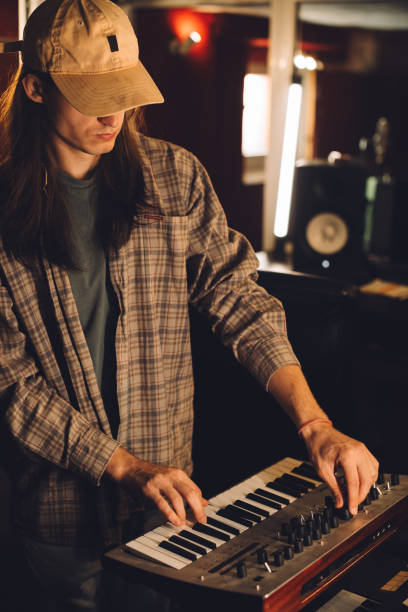 istock Musician playing keyboard in recording studio. 2186509367