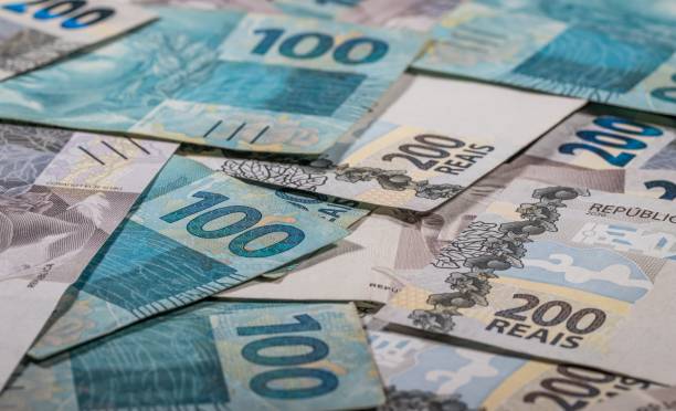 istock Background and texture with Brazilian Reais banknotes. 2186509618