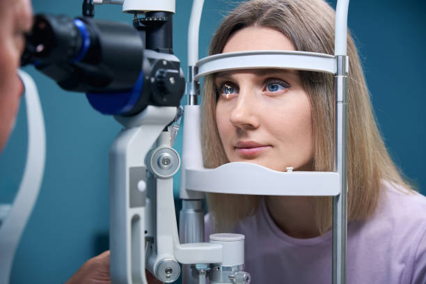 istock Female patient getting healthy visual refraction eye test at ophthalmologist clinic 2186509721