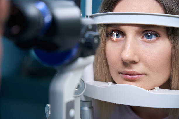 istock Young woman is diagnosed with eye pressure on special ophthalmological equipment 2186509727