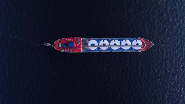 istock Large ship with a blue stripe and white circles is sailing in the ocean 2186512748