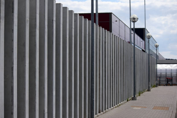 istock .construction of a building with a metal gate and lanterns in the middle 2186514519