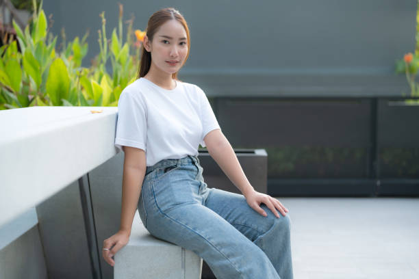 istock Young asian woman relaxing on bench 2186514849
