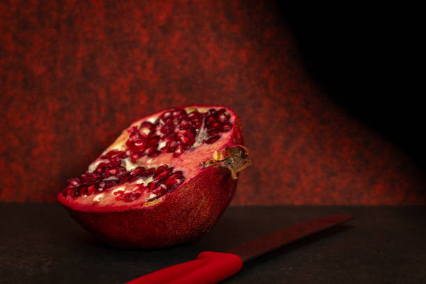 Fresh pomegranate red fruit with red color background