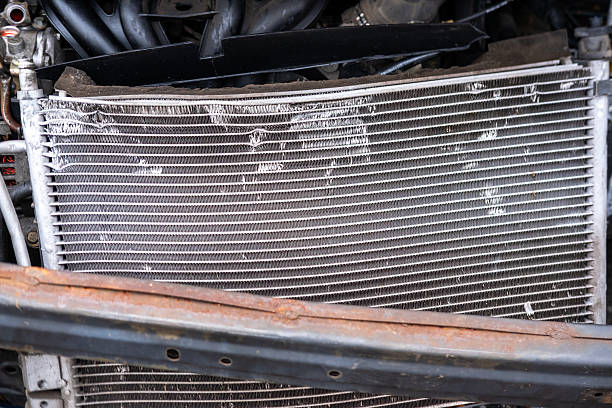 istock heavily damaged car with crumpled hood and exposed engine, aftermath collision, crash scene, with visible damage to front end 2186517435