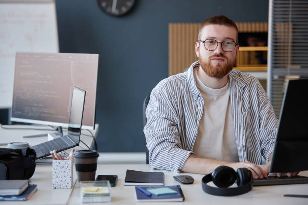 istock Portrait of Bearded Man Working in Modern Office 2186518821