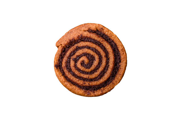 Freshly baked cinnamon roll with spices and cocoa filling on a white background. Cinnabon buns. Swedish breakfast.