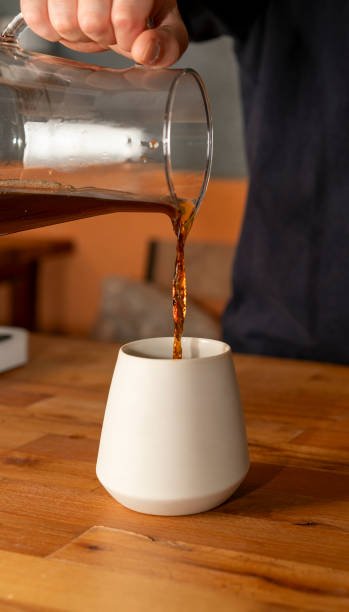 istock Pouring coffee from a V60 server into the favorite cup, filter coffee 2186523254