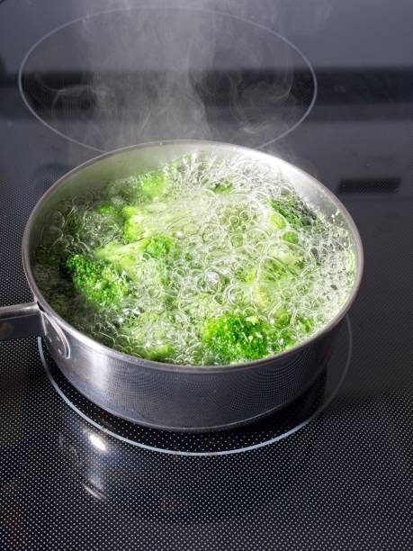 istock Boiling broccoli in a cook pan on a stove 2186523377