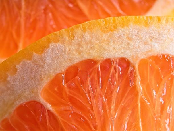 Fresh succulent grapefruit in layered pattern sowing texture and detail