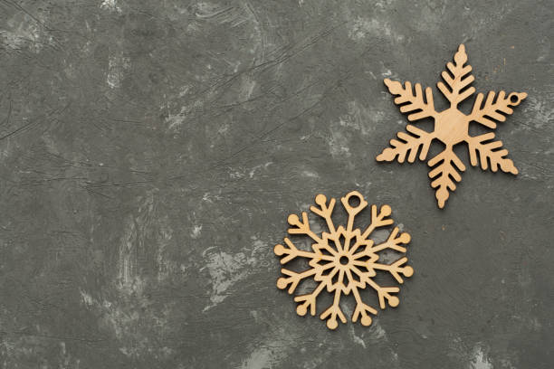 istock Beautiful snowflake on concrete background, top view 2186528151