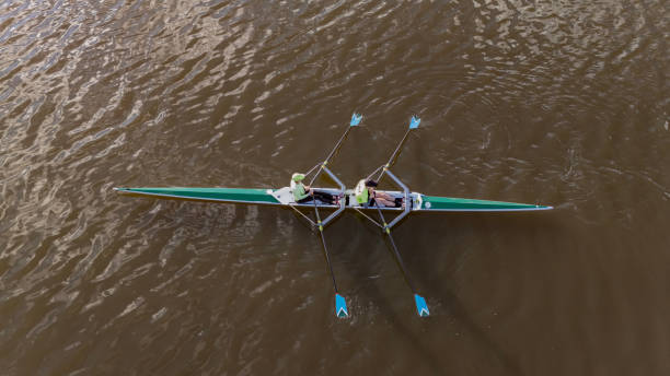 On a calm spring morning, rowers are found in their sculls on the Fox River, De Pere, WI.