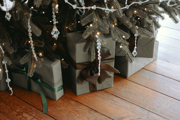 istock Beautifully wrapped holiday gifts under a decorated Christmas tree 2186542989
