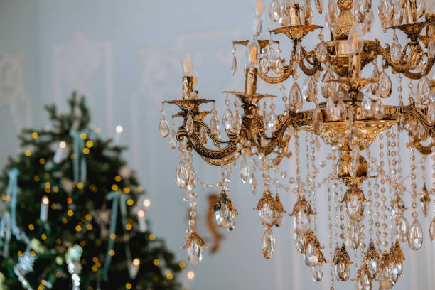 istock Elegant chandelier hanging above a beautifully decorated Christmas tree 2186543021